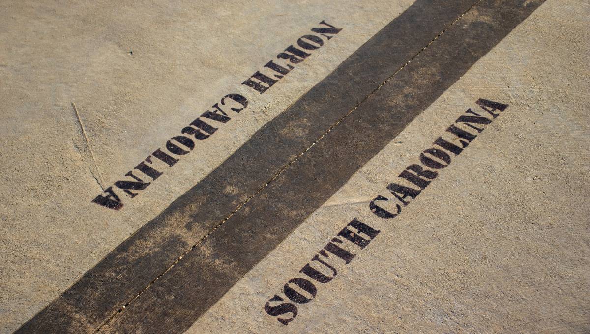 The painted border line that divides and marks North Carolina and South Carolina, found at Sassafras Mountain.
